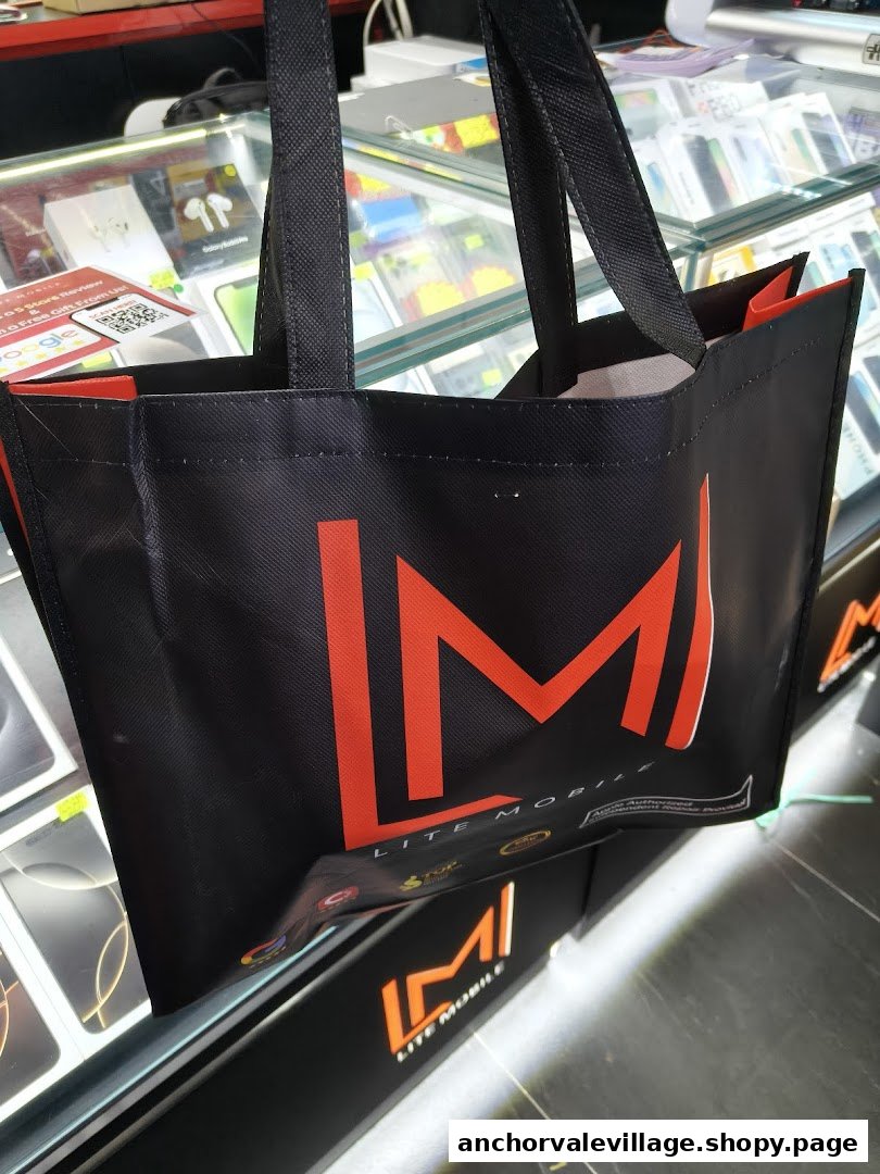 A Lite Mobile branded shopping bag displayed inside a mobile phone and accessories shop.