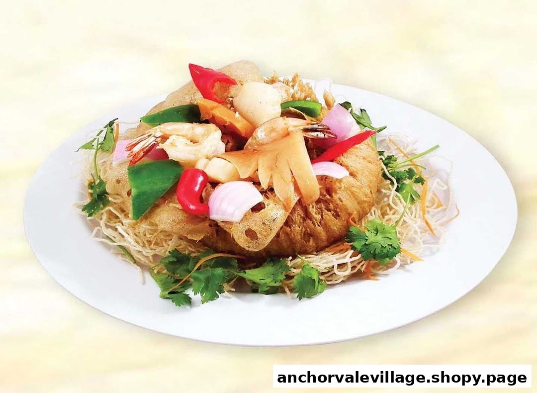 A vibrant seafood and vegetable dish served in a crispy noodle basket on a white plate.