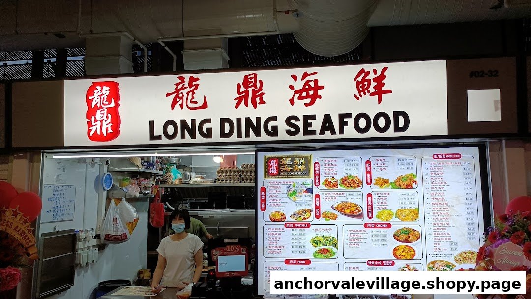 Front view of Long Ding Seafood stall featuring its signboard, a large menu, and a staff member.
