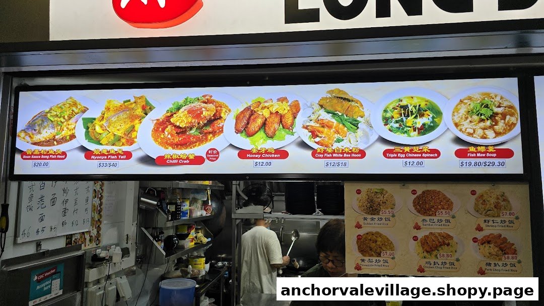 A brightly lit menu board showcasing various seafood and Chinese dishes with prices, above a bustling kitchen.
