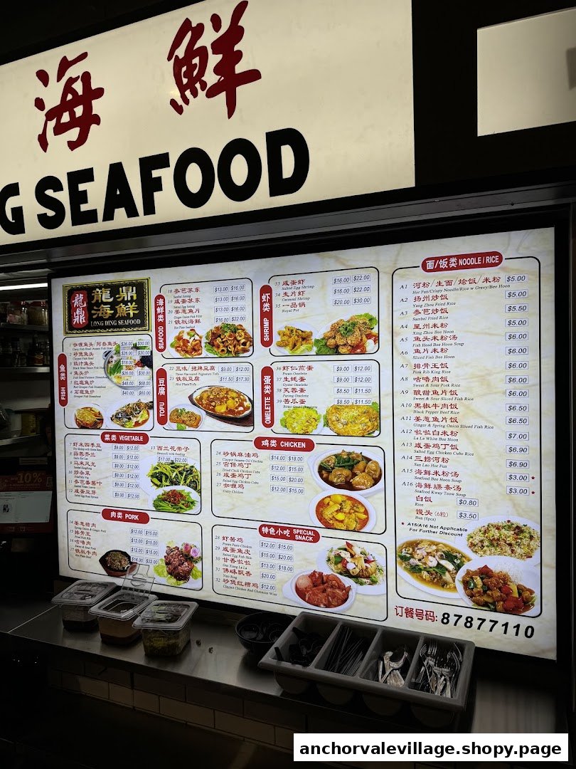 A brightly lit menu board displaying a wide variety of seafood, meat, and noodle dishes.