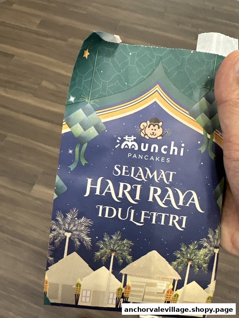 A festive Munchi Pancakes bag featuring a 'Selamat Hari Raya Idulfitri' design.