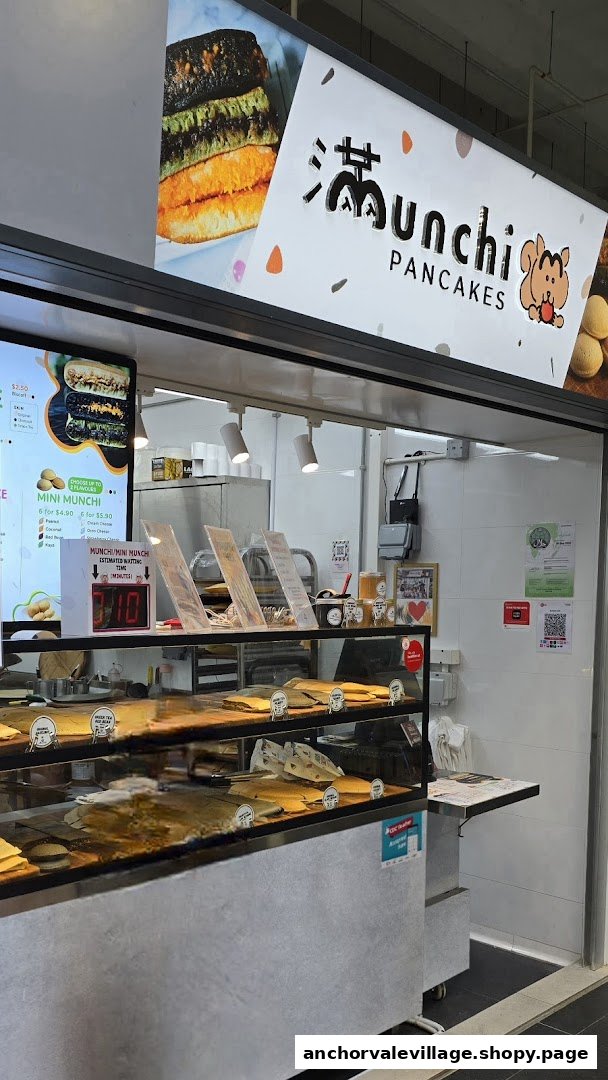 A vibrant display of Munchi Pancakes' counter, showcasing their menu board and fresh products.