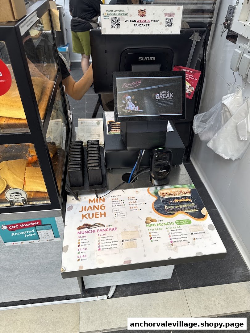 A close-up view of the Munchi Pancakes counter, displaying various pancake options and a menu.