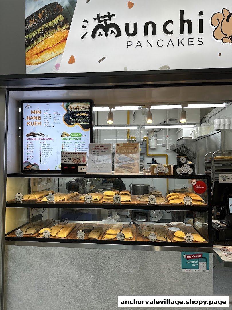 A detailed view of Munchi Pancakes' counter, showcasing their digital menu and freshly prepared pancakes.