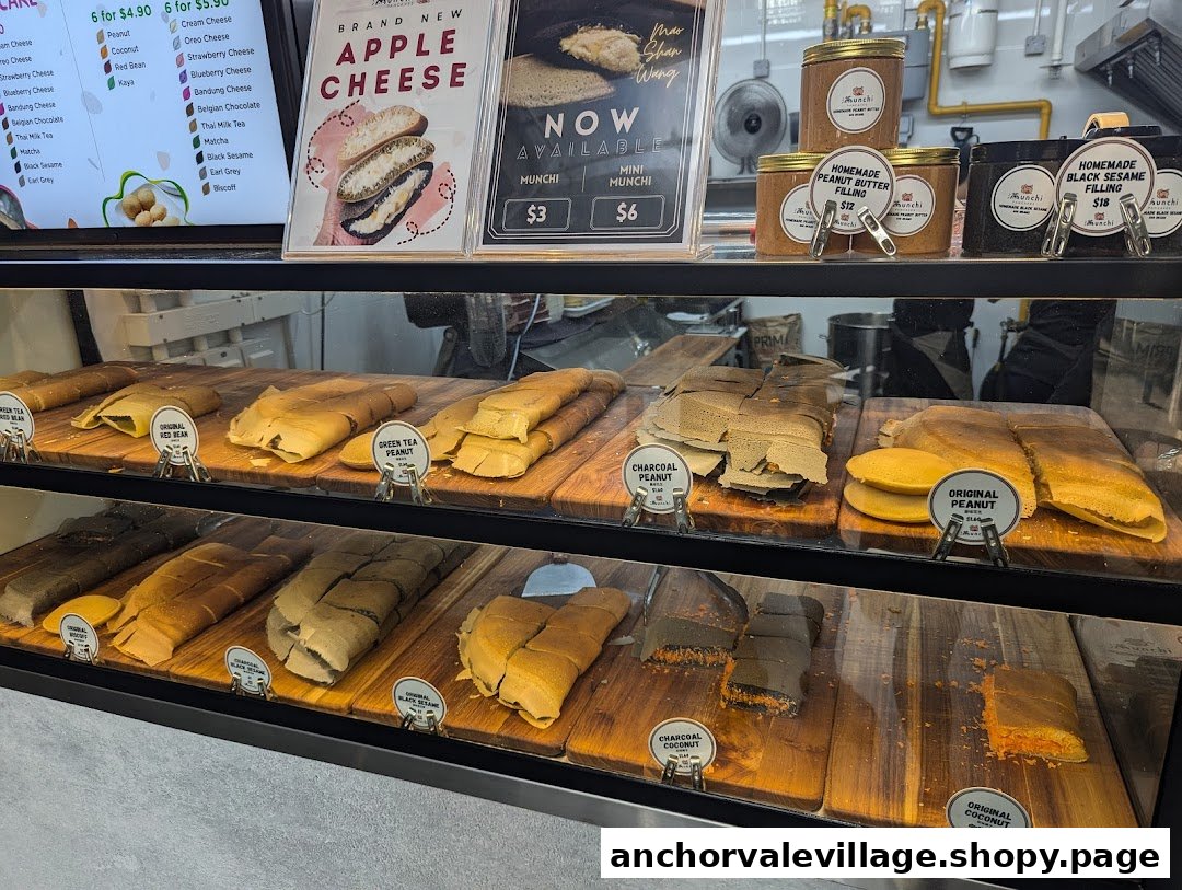 A vibrant display of Munchi Pancakes in a glass case, featuring various flavors and fillings.