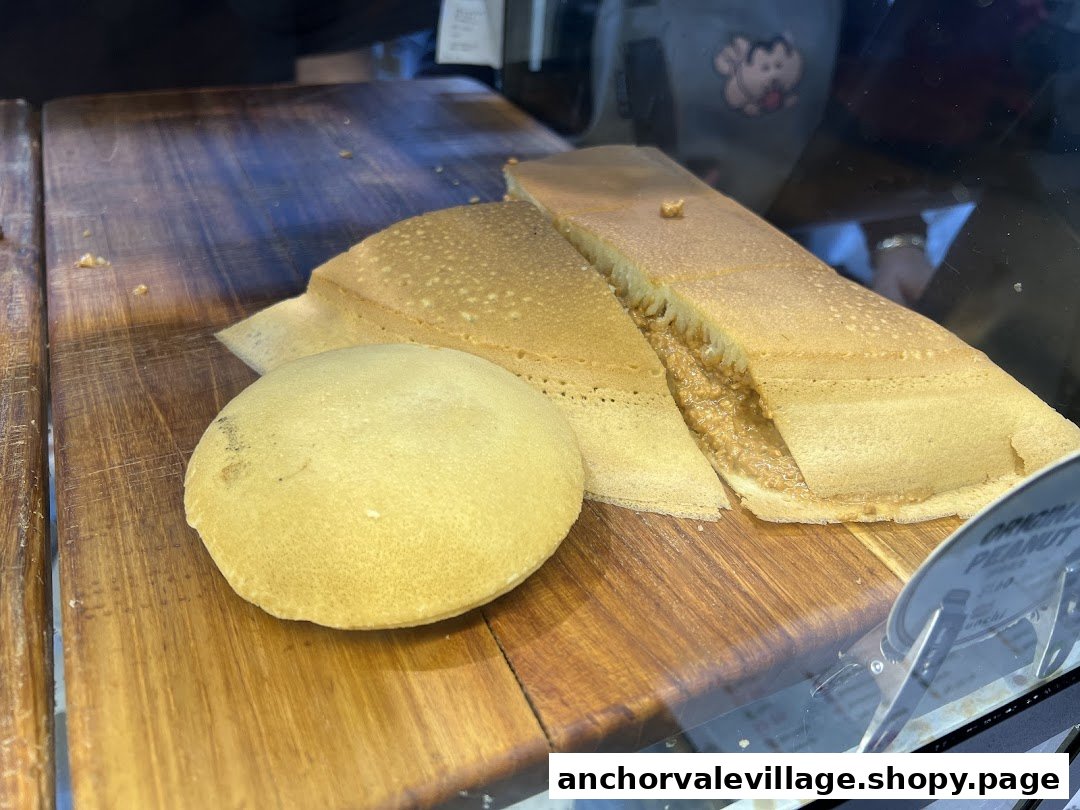 Delicious Munchi Pancakes, including a peanut-filled one, displayed on a wooden board.