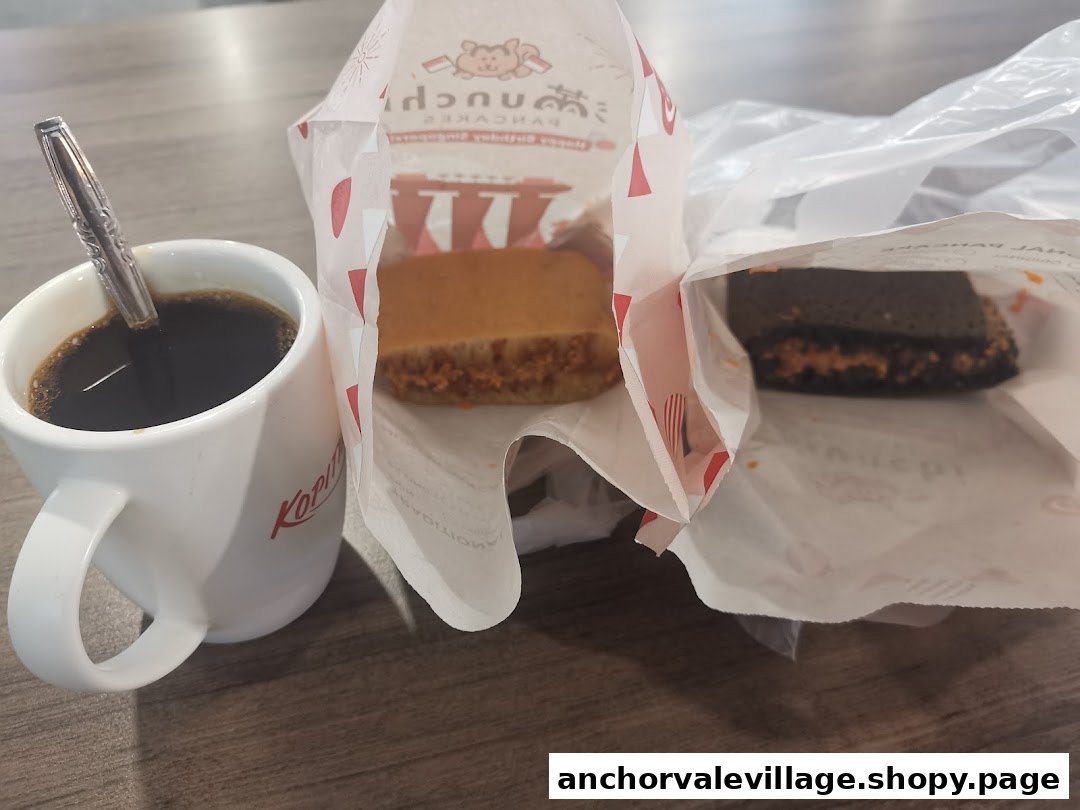 A delightful spread of Munchi Pancakes, including classic and chocolate flavors, paired with a hot coffee.