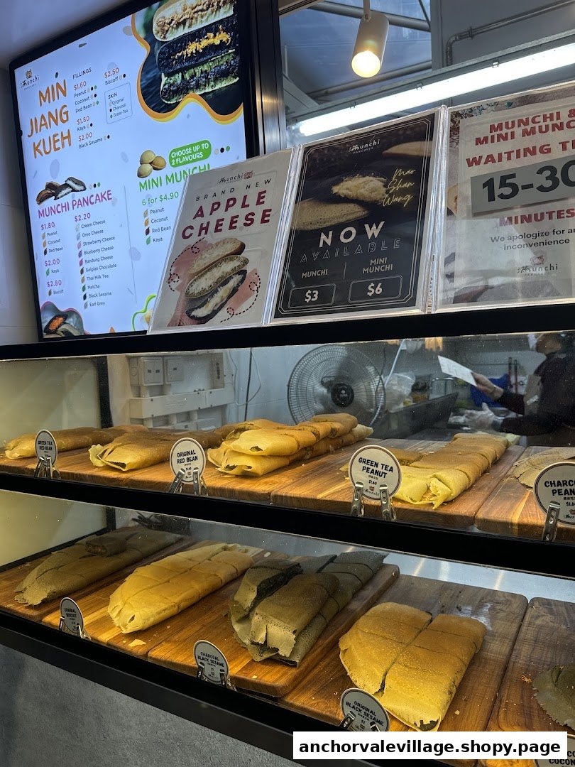 A vibrant display of traditional and specialty pancakes with detailed menu boards.