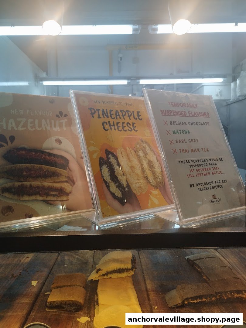 A display showcasing Munchi Pancakes' new and temporarily suspended flavors with actual pancake samples.