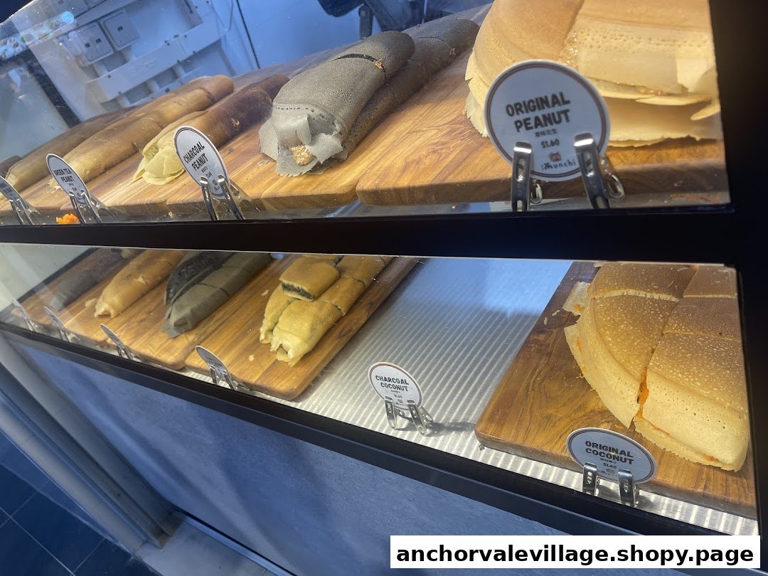 A vibrant display of Munchi Pancakes in a glass case, featuring various flavors and textures.