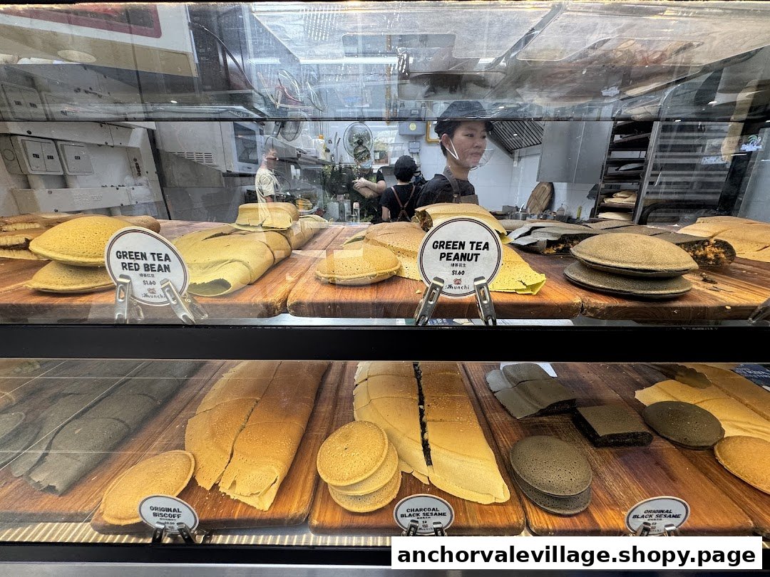 A vibrant display case showcasing various freshly made Munchi Pancakes in different flavors.