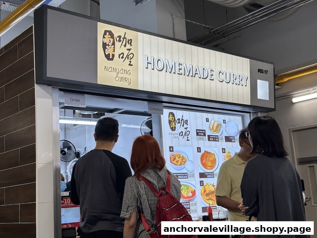 Customers queueing at the Nanyang Curry food stall, featuring its prominent 'Homemade Curry' signage and digital menu.