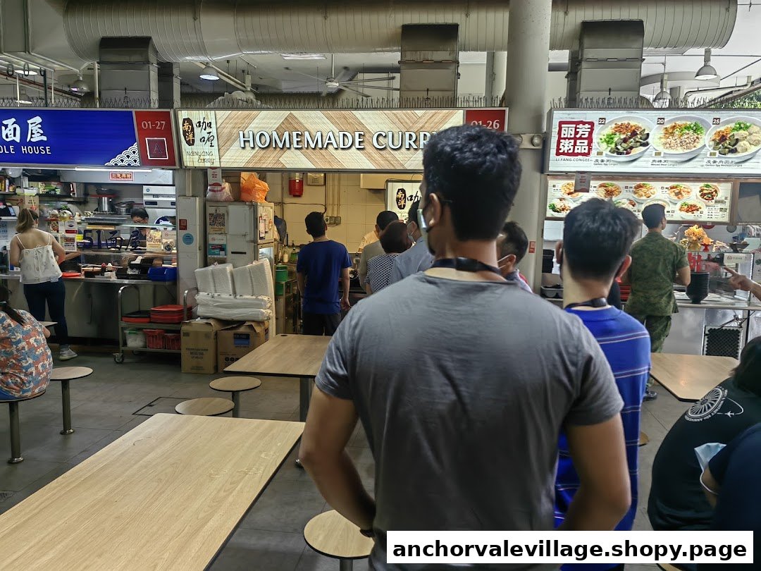 Customers gather at Nanyang Curry and other food stalls in a bustling food court setting.
