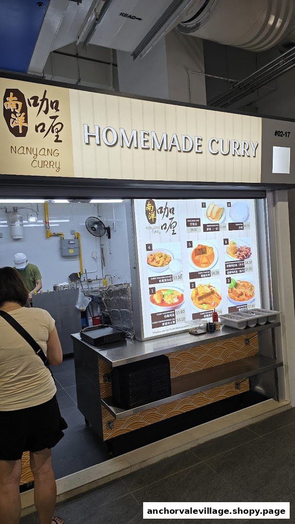 A vibrant display menu of Nanyang Curry, showcasing various homemade curry dishes and sides.