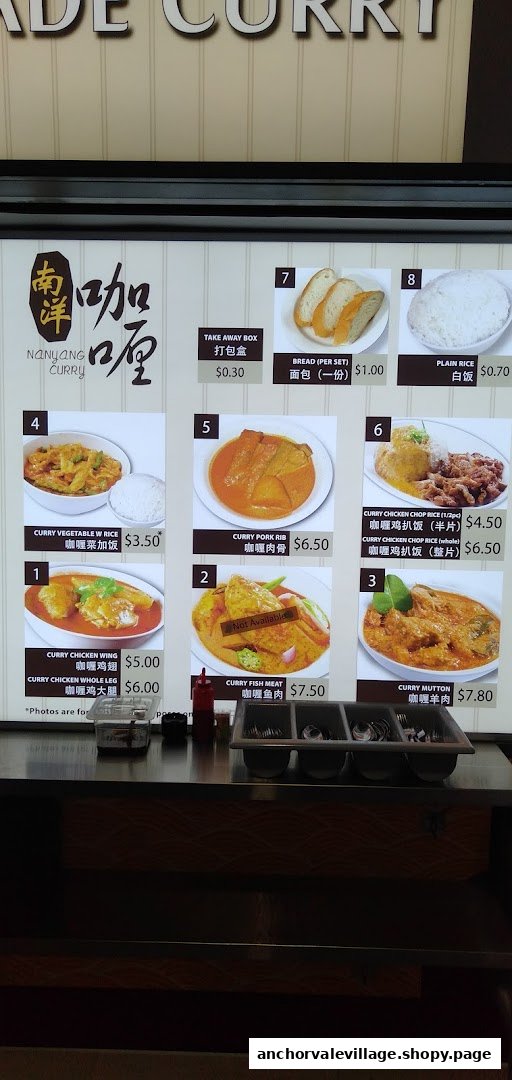 A menu board displaying various curry dishes and prices at Nanyang Curry.