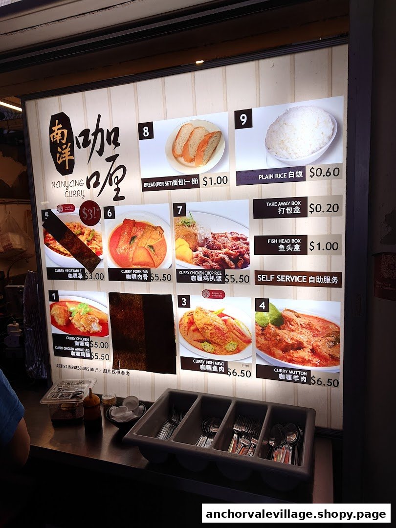 A brightly lit menu board displaying various curry dishes and prices at Nanyang Curry.