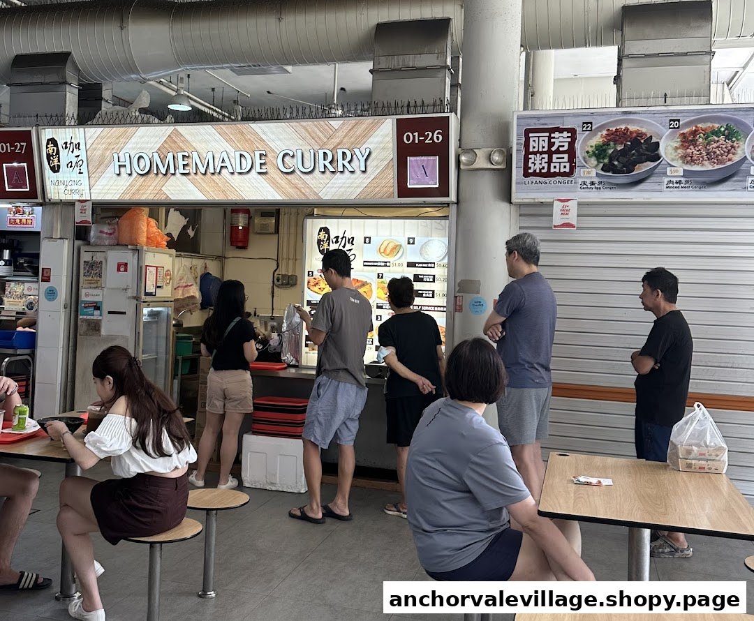 A bustling food stall named "Homemade Curry" in a food court, with customers ordering and dining.