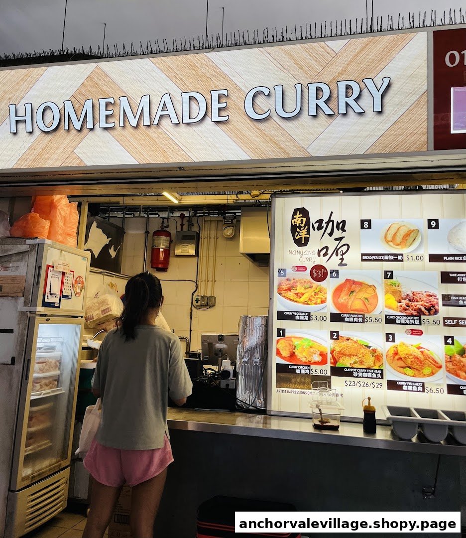 A customer at the counter of Nanyang Curry, with a detailed menu board displaying various curry dishes.