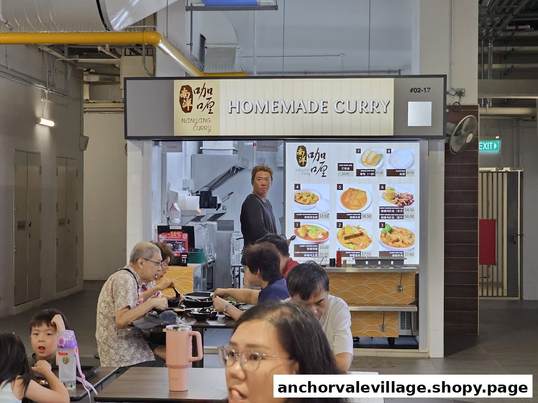 A bustling Nanyang Curry stall in a food court, featuring its menu and customers dining.