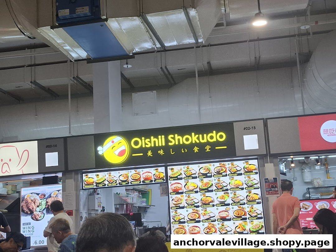The brightly lit front of Oishii Shokudo, featuring its cheerful logo and extensive visual menu displays.