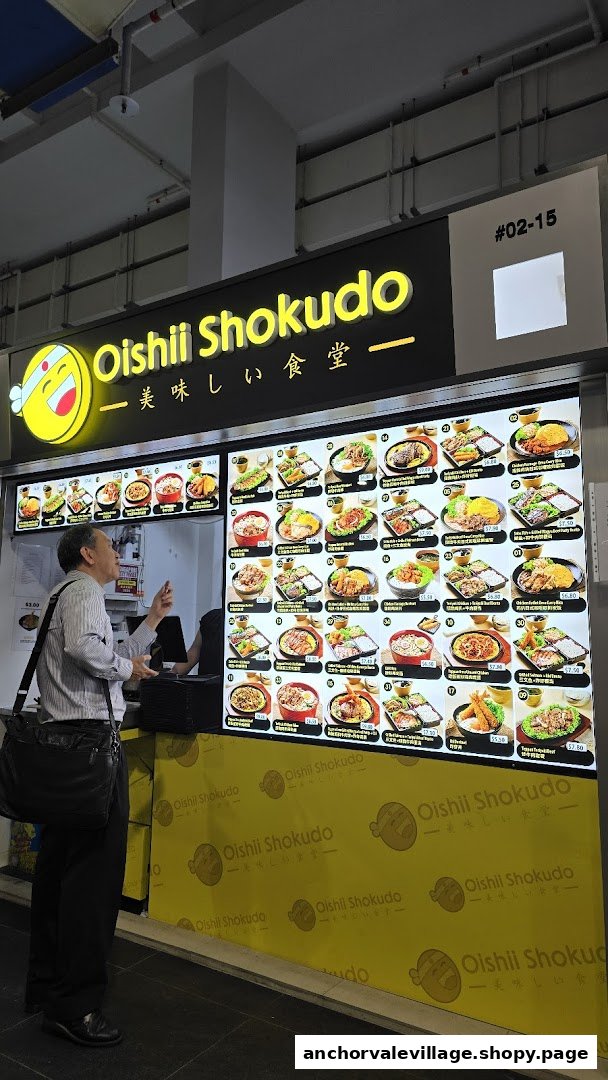 A customer views the extensive digital menu board at Oishii Shokudo, showcasing various Japanese dishes.