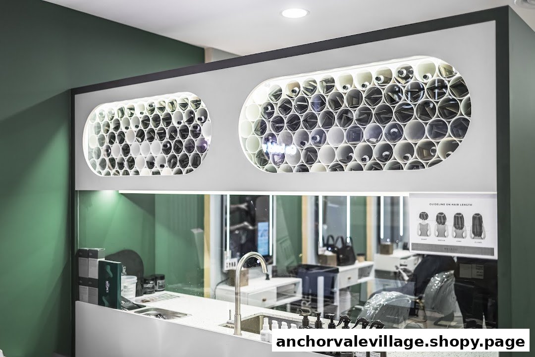 A modern hair salon interior featuring a product display counter, sink, and a view into the styling area.