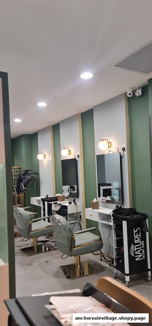 An interior view of Organic Express Hair Color Lab, featuring modern styling stations and chairs.