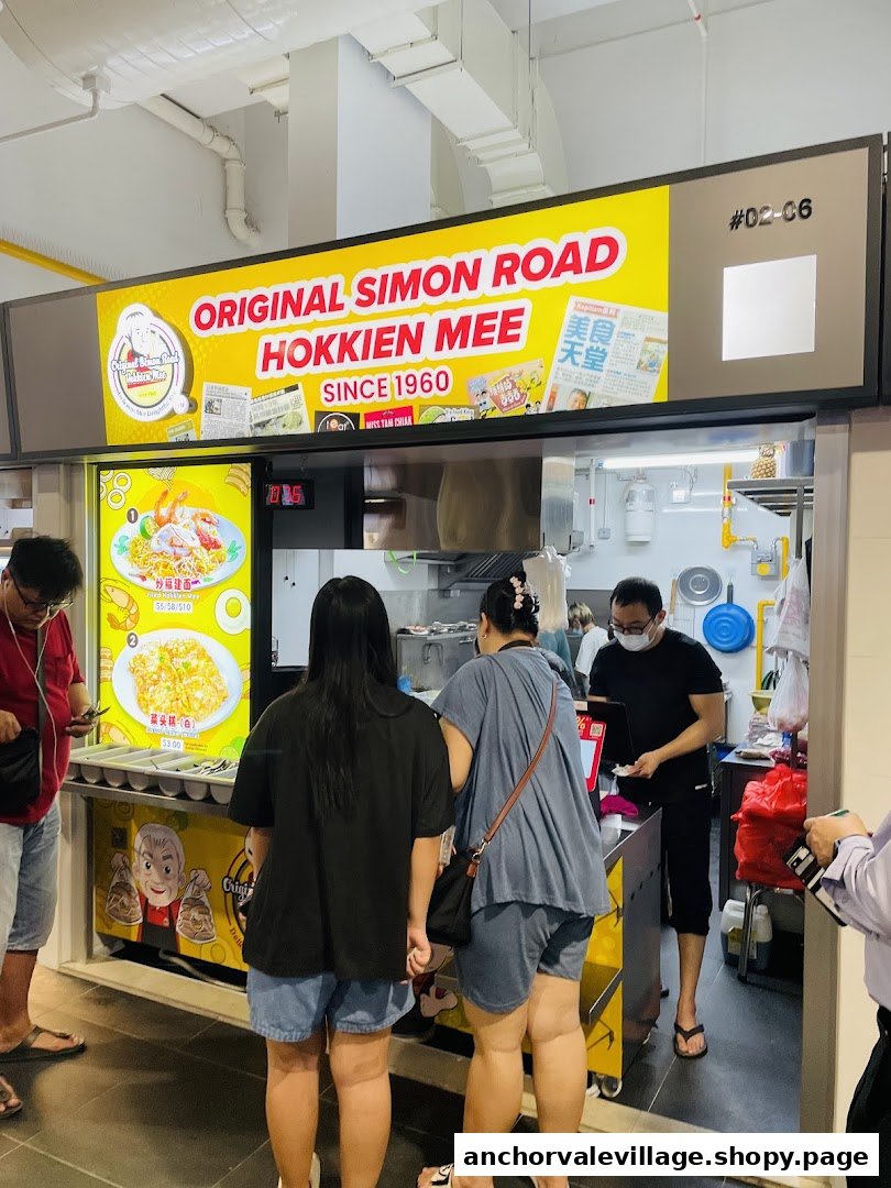 Customers ordering at Original Simon Road Hokkien Mee stall, showcasing its heritage.