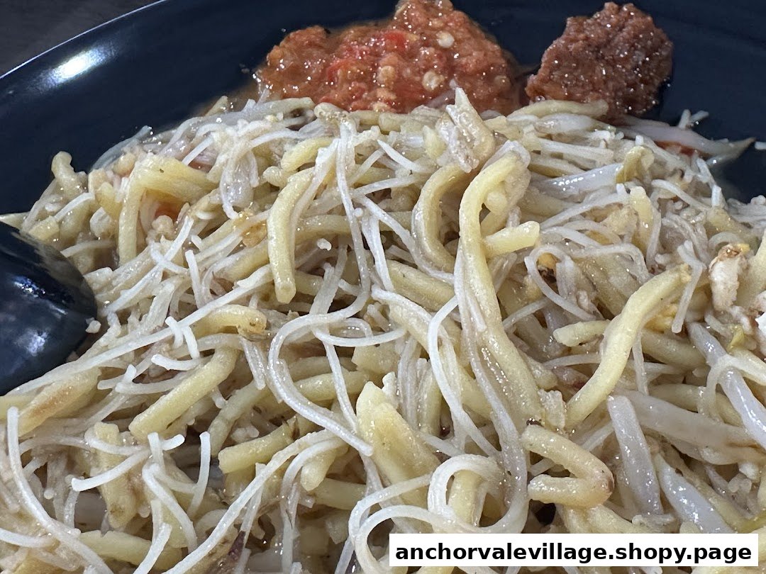 Close-up of Original Simon Road Hokkien Mee, featuring noodles, bean sprouts, and chili.