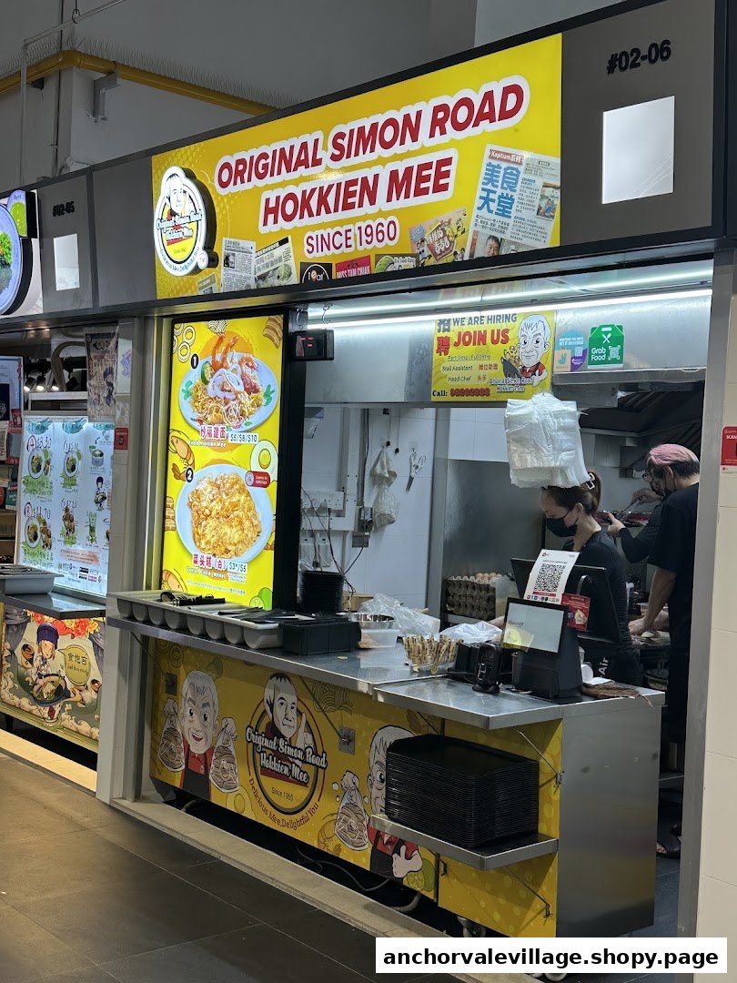 A vibrant food stall displaying its signature Hokkien Mee and Oyster Omelette menu with prices.