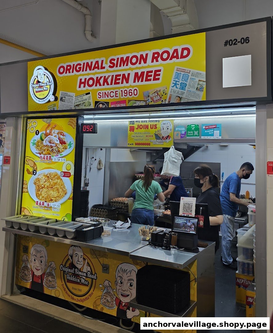 A bustling hawker stall, 'Original Simon Road Hokkien Mee', with staff preparing food.