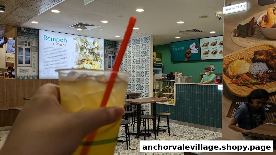 Interior view of Rempah by Chilli Padi, featuring a drink in the foreground and dining area.