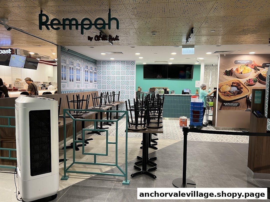 Interior view of Rempah by Chilli Padi, featuring dining tables, a service counter, and traditional decor.
