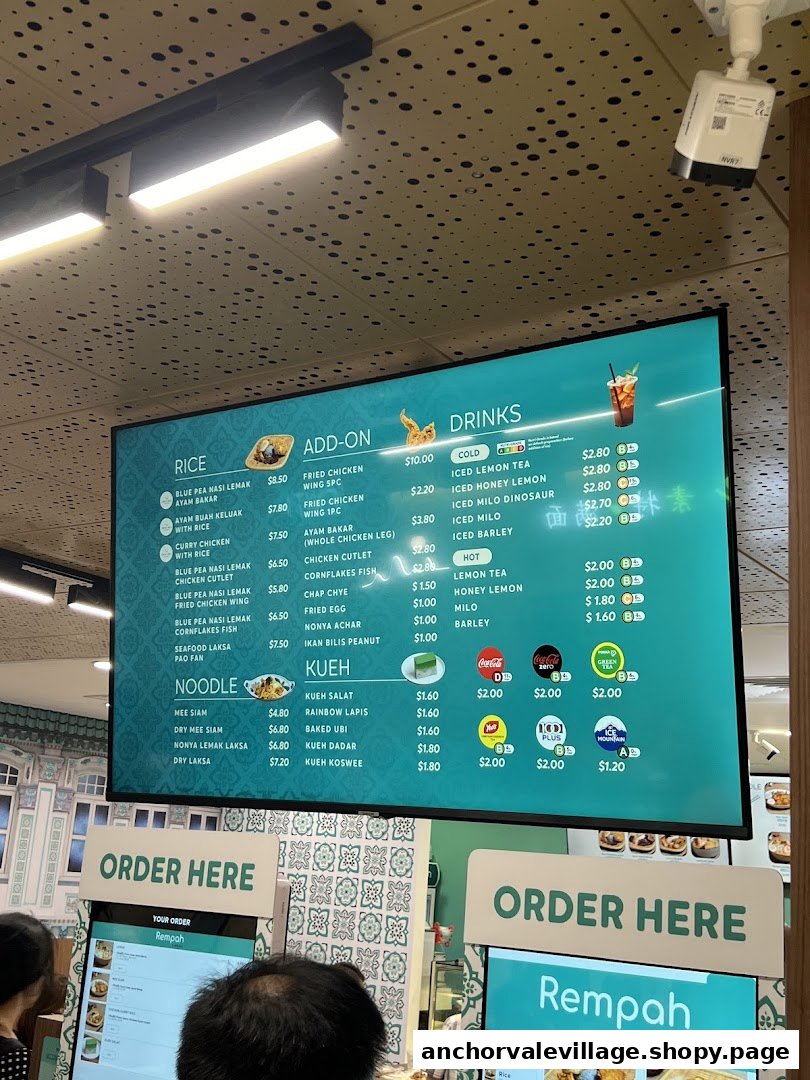 A large digital menu board displaying food and drink options for Rempah by Chilli Padi.