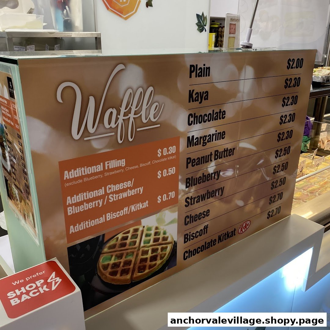 A menu board displaying various waffle flavors and additional filling options with their prices.