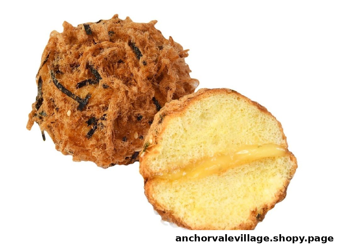 A fluffy bun covered in savory meat floss and seaweed, with a creamy cheese filling inside.