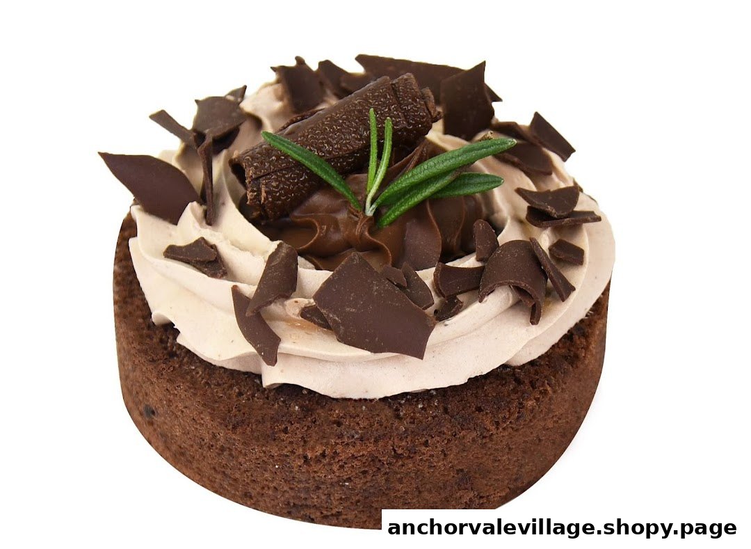 A decadent chocolate tart topped with creamy frosting, chocolate shavings, and a sprig of rosemary.