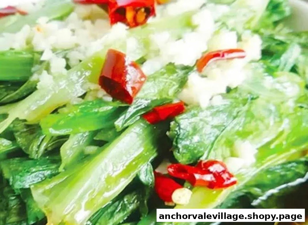A vibrant close-up of stir-fried green vegetables with garlic and red chilies, a fresh and flavorful dish.