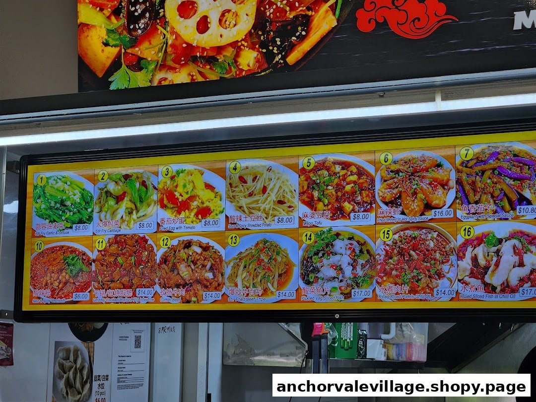 A brightly lit digital menu board displaying various Chinese dishes with images and prices.