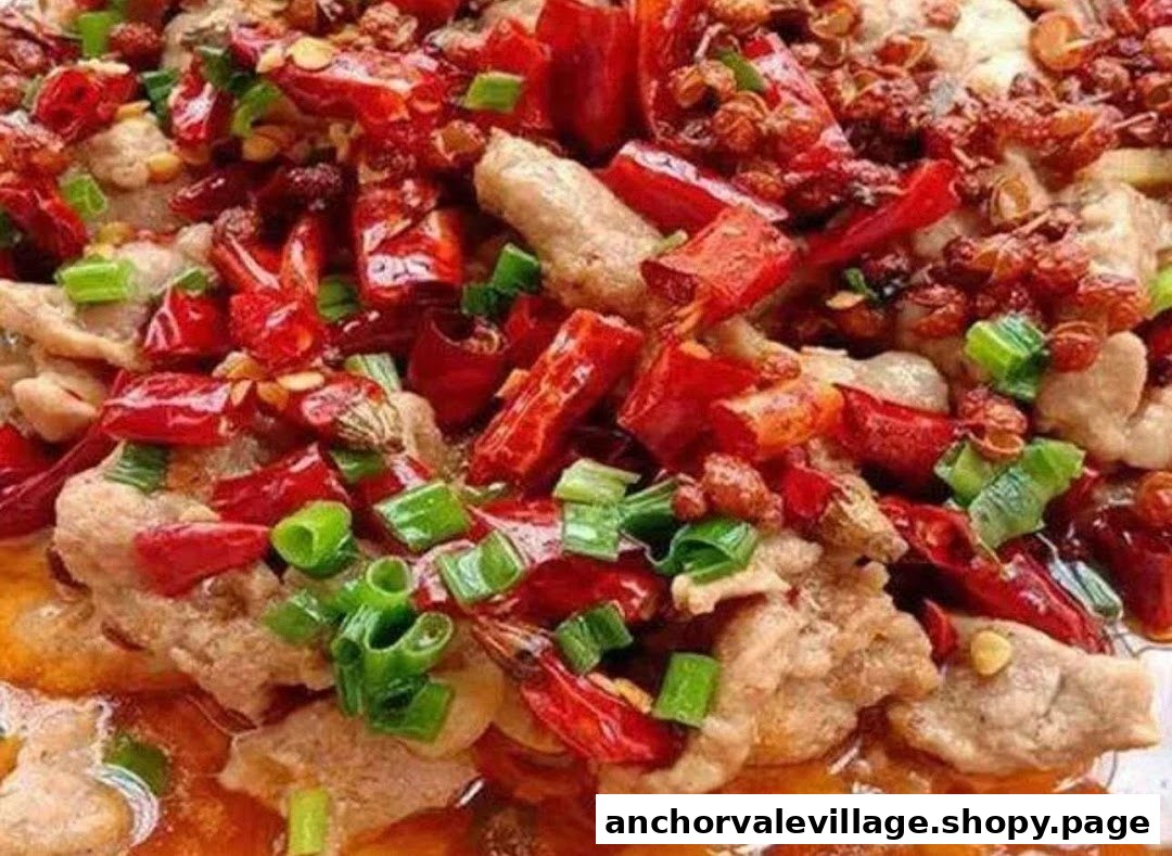 A close-up of a spicy dish featuring meat, red chilies, Sichuan peppercorns, and green onions.