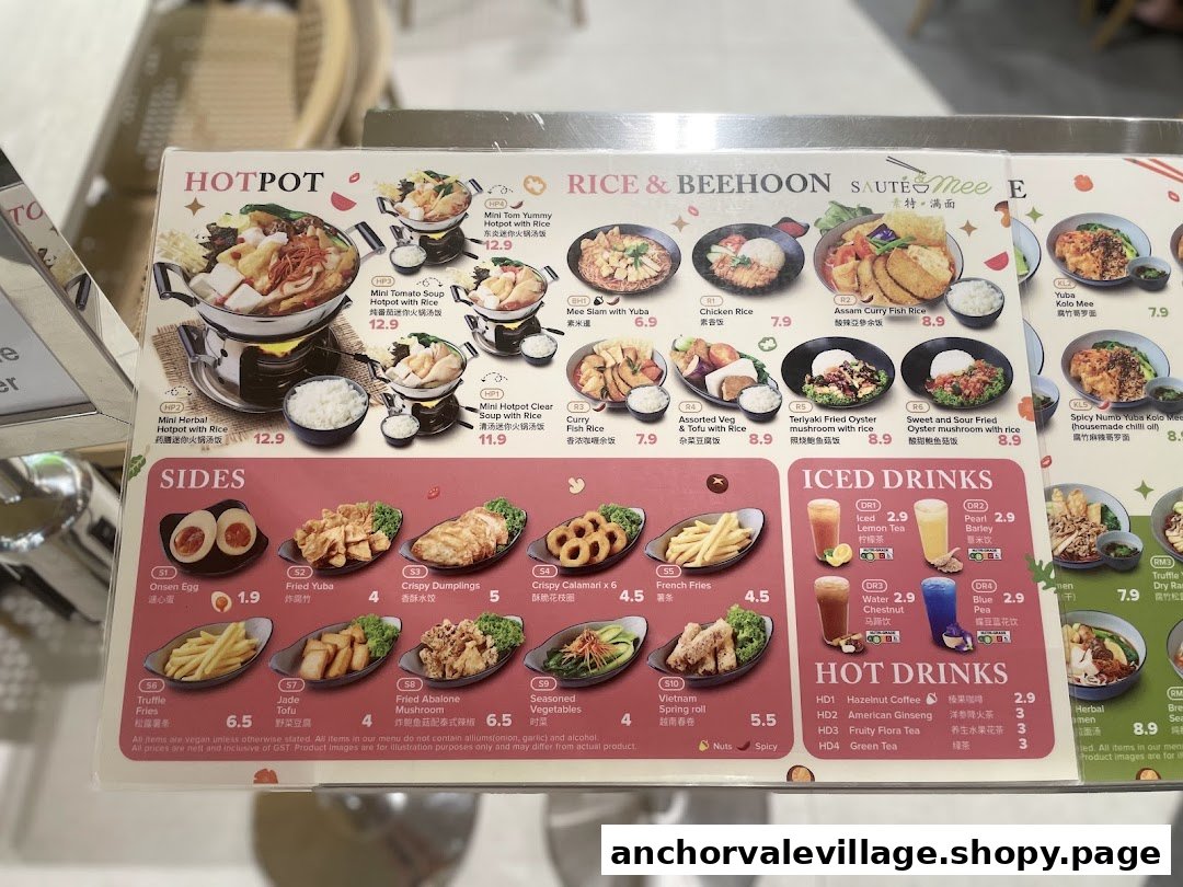 A comprehensive menu board displaying hotpot, rice, noodle dishes, sides, and drinks.