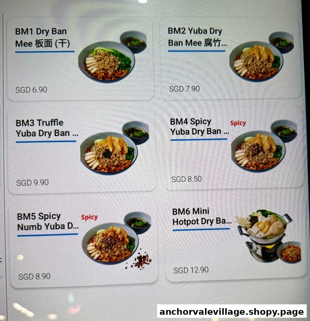 A digital menu displaying various Dry Ban Mee and Yuba Dry Ban Mee dishes with prices.