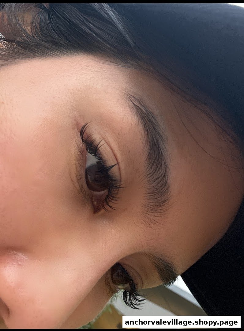 Close-up of a person's eye showcasing beautifully applied eyelash extensions.