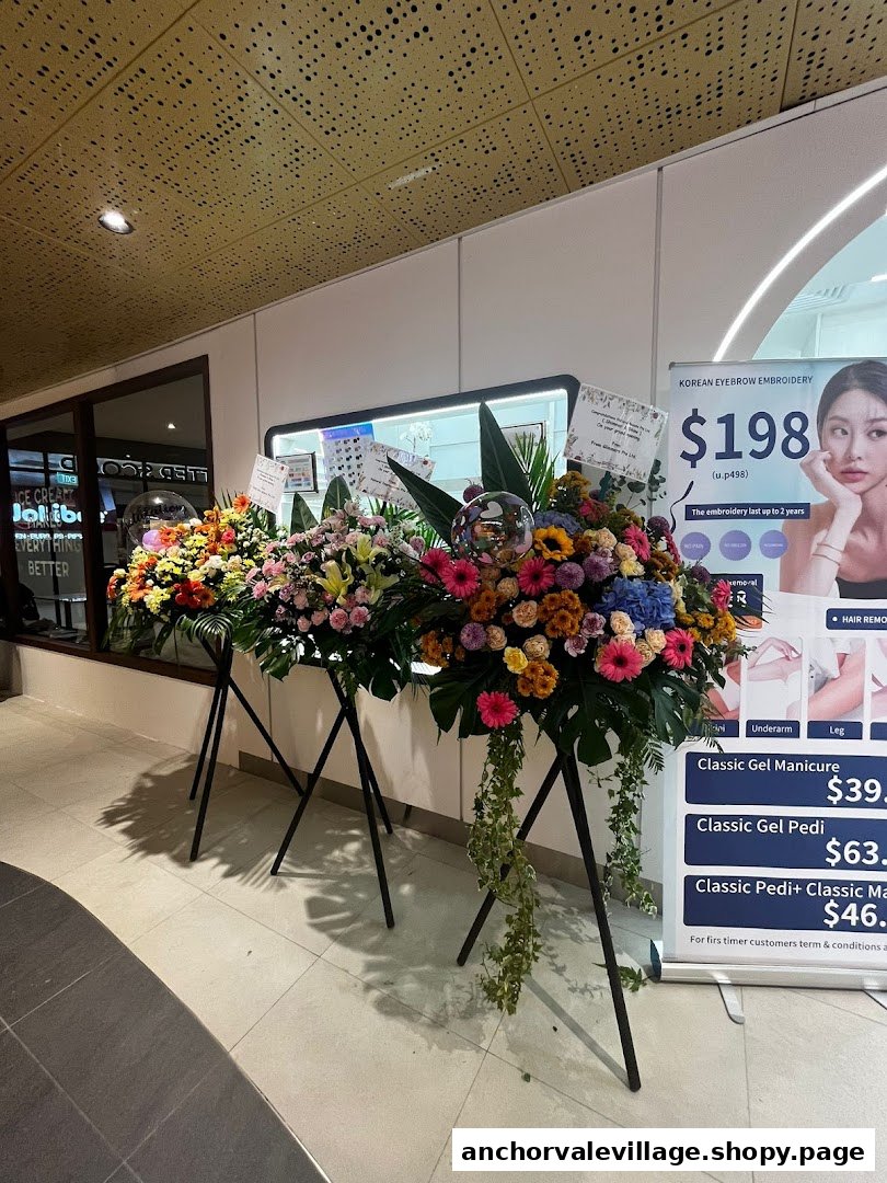 Shop entrance with congratulatory flowers and a prominent banner displaying beauty service prices.