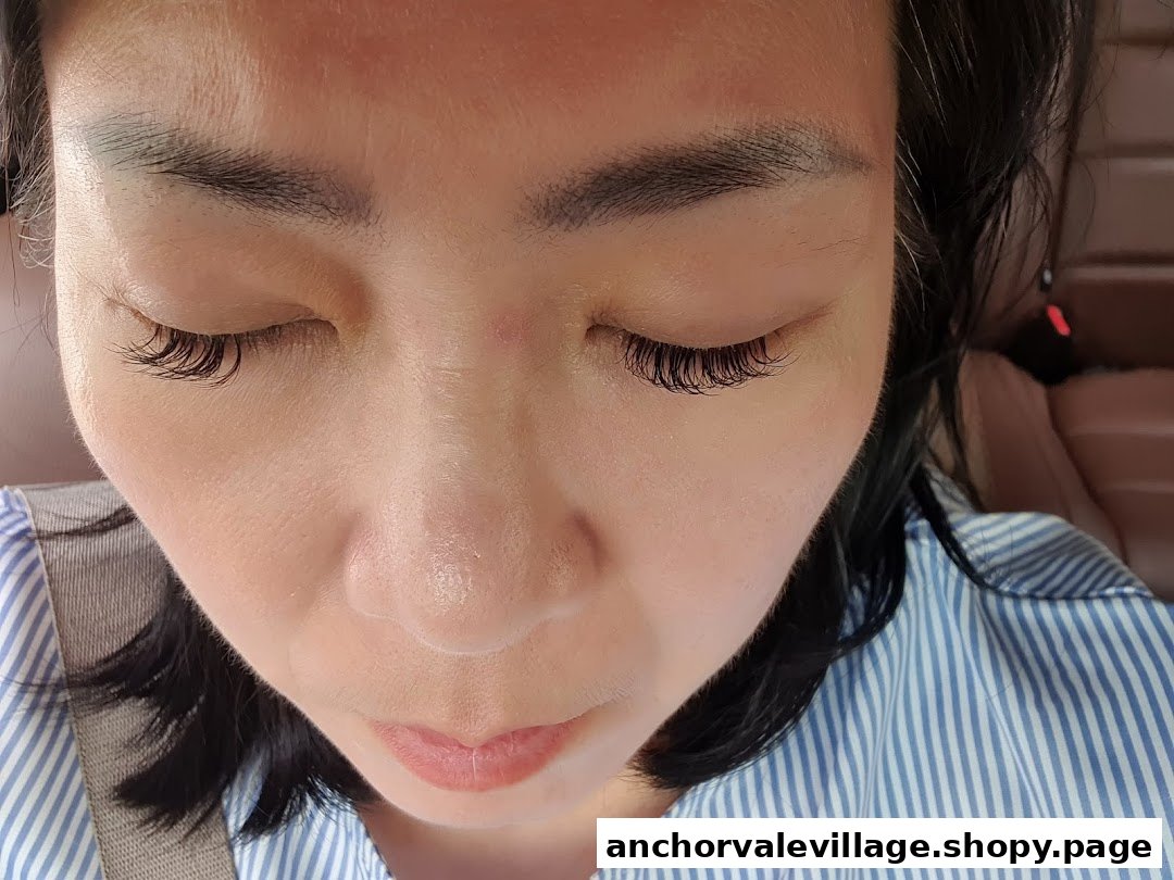 Close-up of a person's face showcasing beautifully enhanced eyelashes, likely a result of a beauty service.