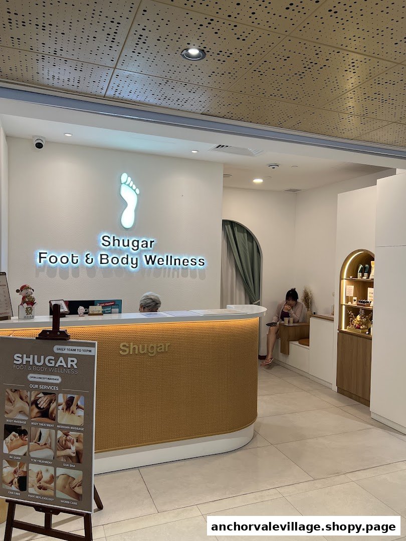 Interior view of Shugar Foot & Body Wellness reception area with a service board.