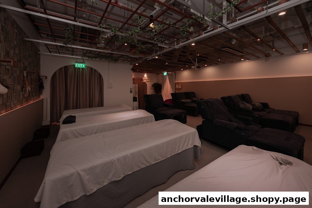 Interior view of Shugar Foot Body Wellness, featuring massage beds and comfortable recliners.