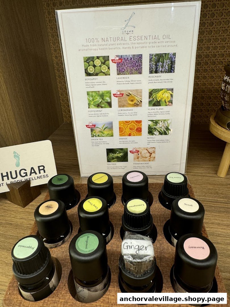 A display of natural essential oils with a descriptive board detailing their benefits and uses.