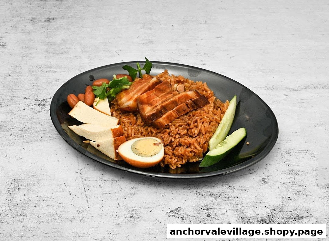 A delicious plate of braised pork belly with savory rice, tofu, egg, and fresh cucumber slices.